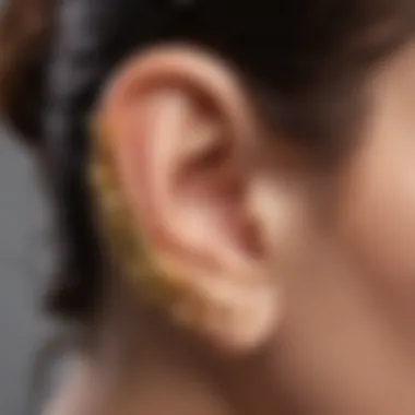 Artisan crafting a unique gold ear cuff with care