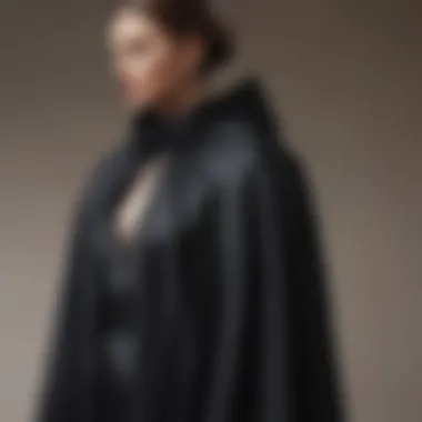 Elegant black formal cape draping on a mannequin