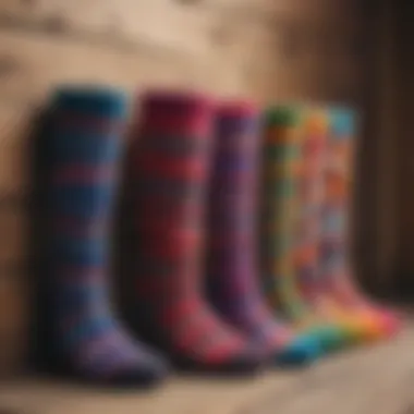 An assortment of leg warmers in various colors and patterns displayed on a wooden surface.